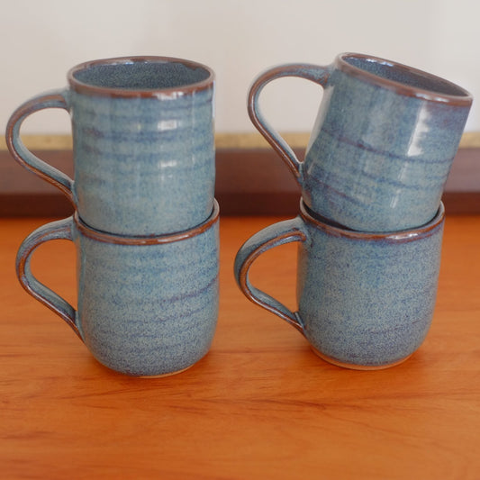Four espresso mugs in variegated blue