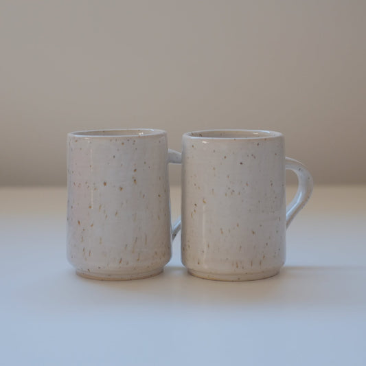 Set of small speckled white mugs