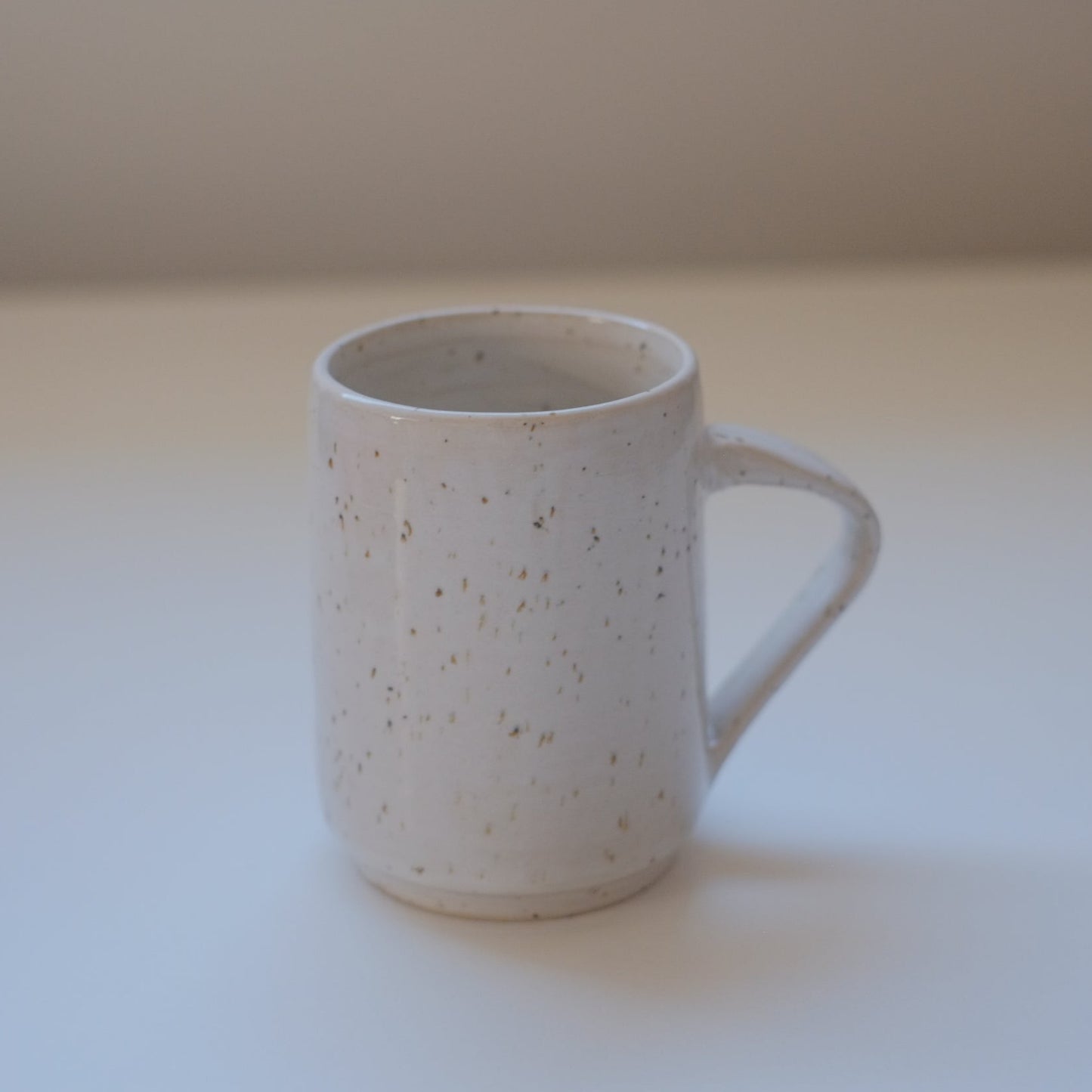 Small speckled white mug