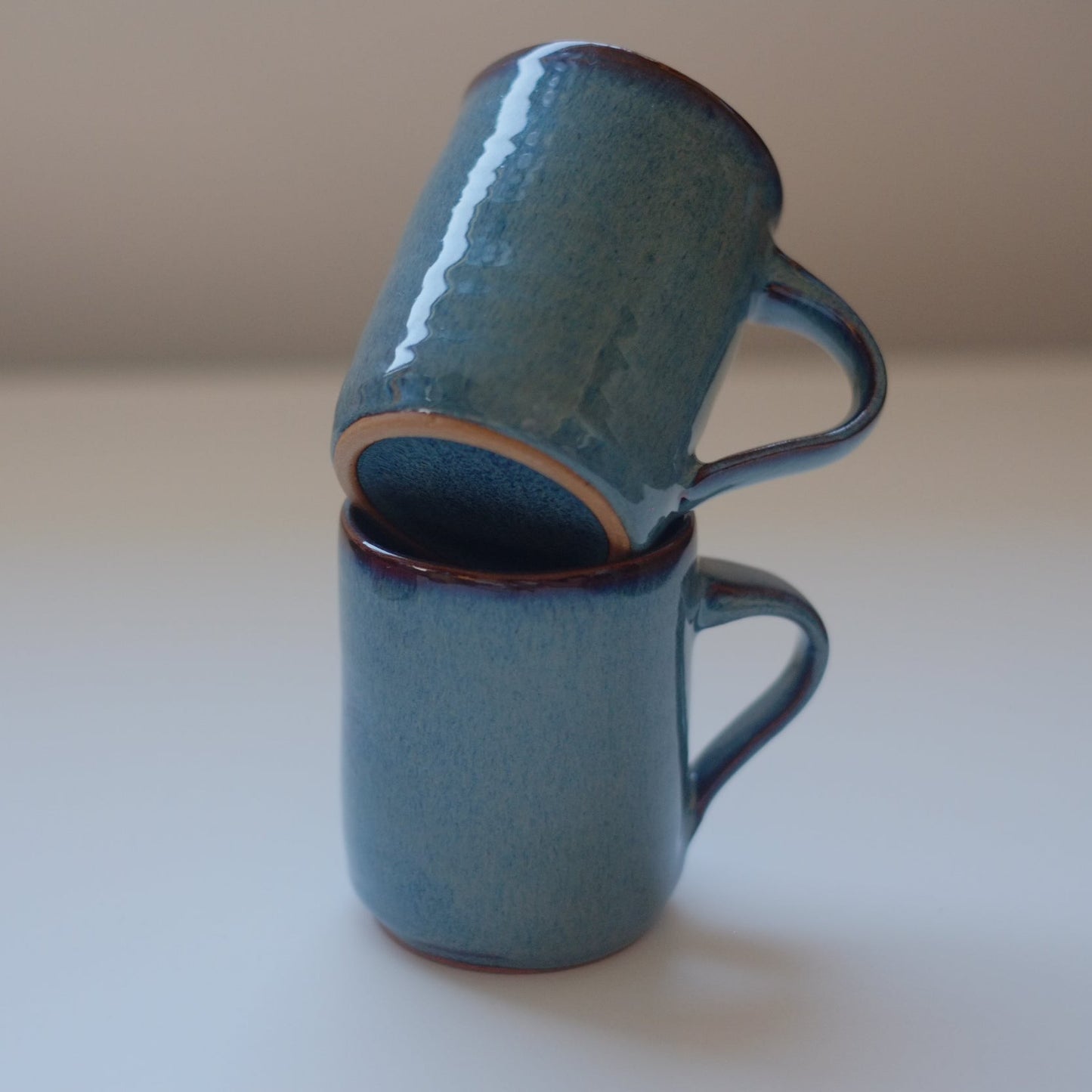 Two small mugs in variegated blue