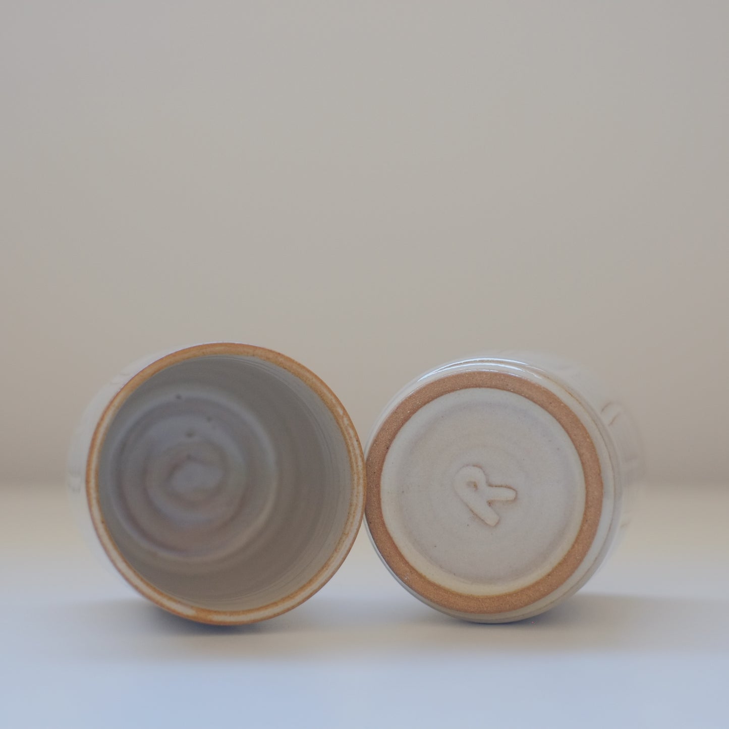 Two X-Small Cream/Tan Tumblers