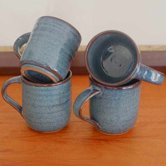 Four espresso mugs in variegated blue