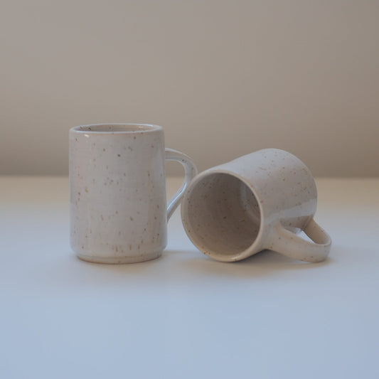 Set of small speckled white mugs