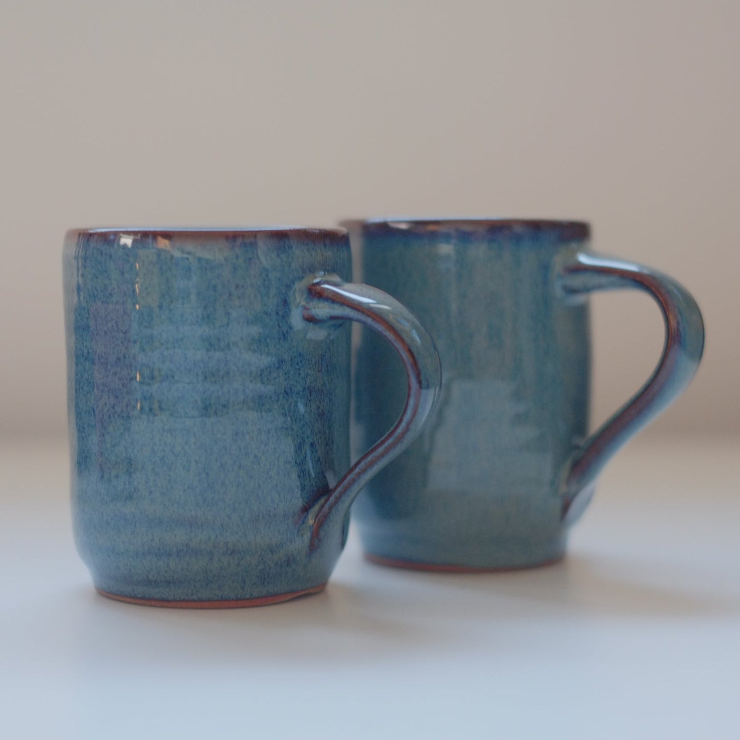Two small mugs in variegated blue