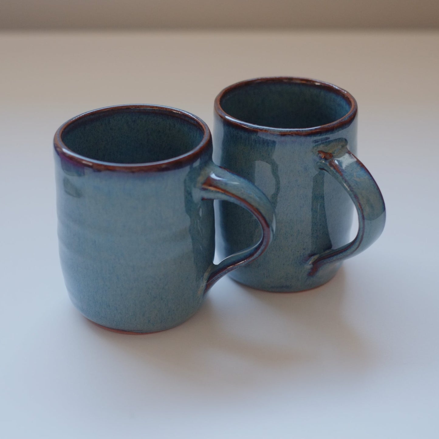 Two small mugs in variegated blue