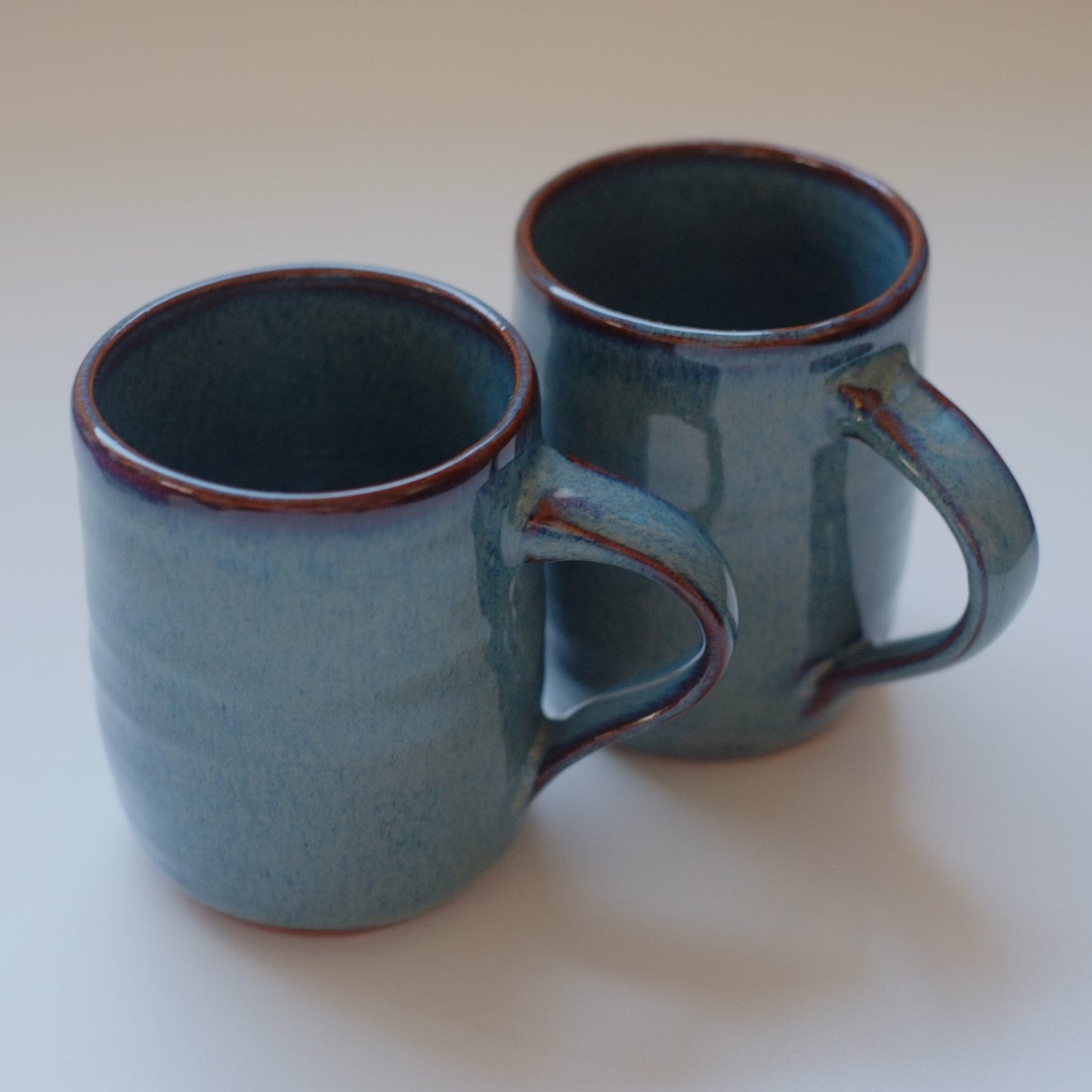 Two small mugs in variegated blue