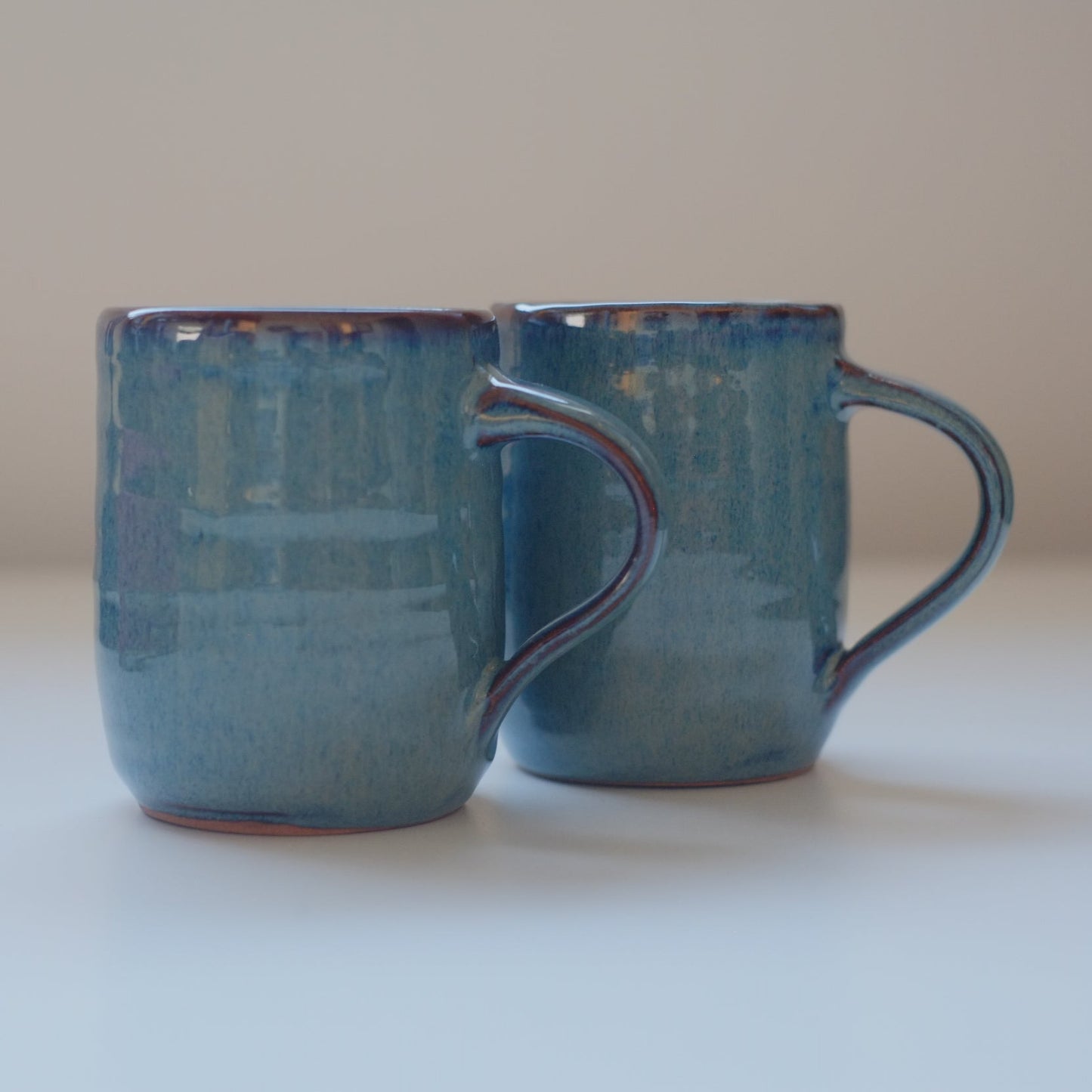 Two small mugs in variegated blue