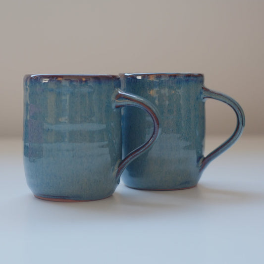 Two small mugs in variegated blue