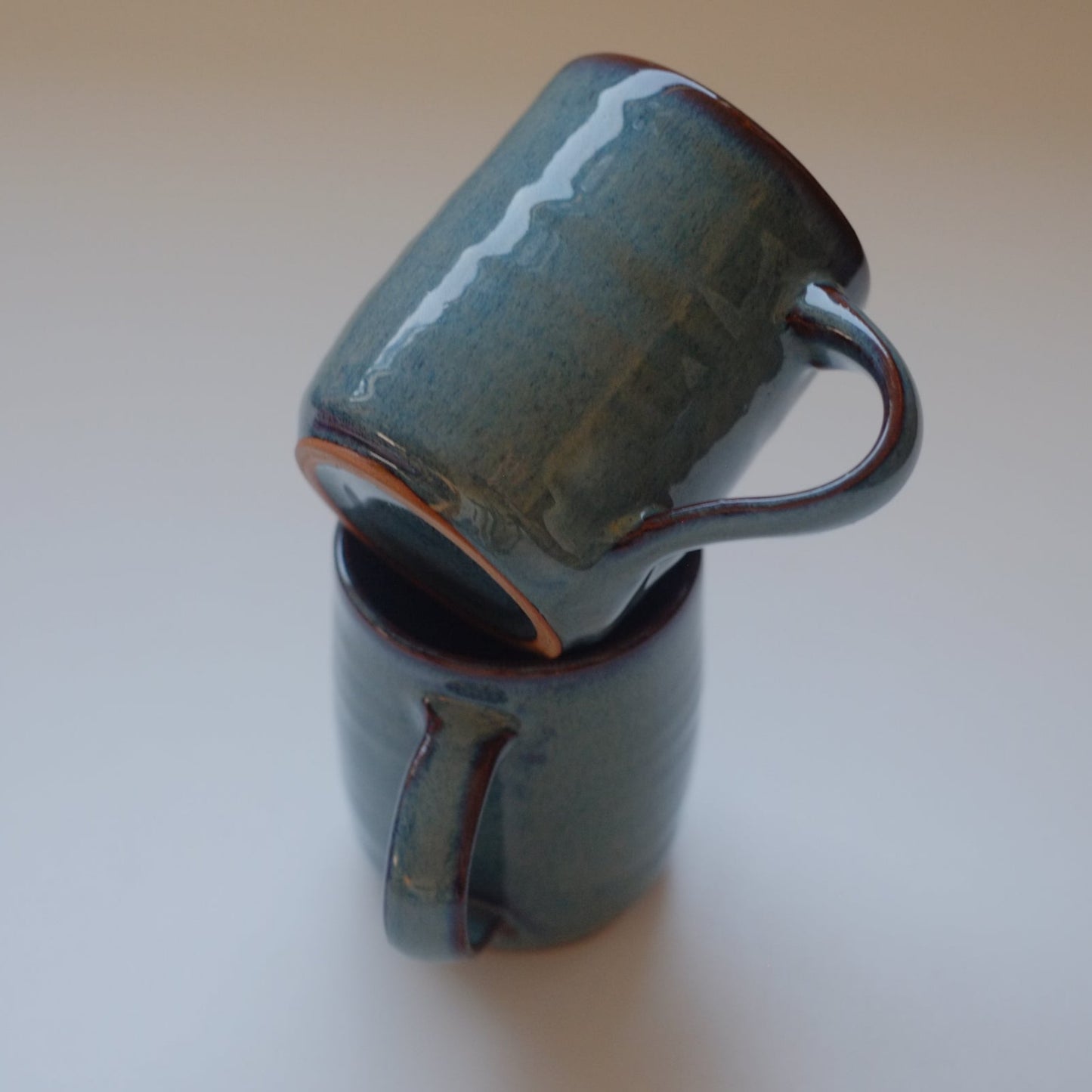 Two small mugs in variegated blue