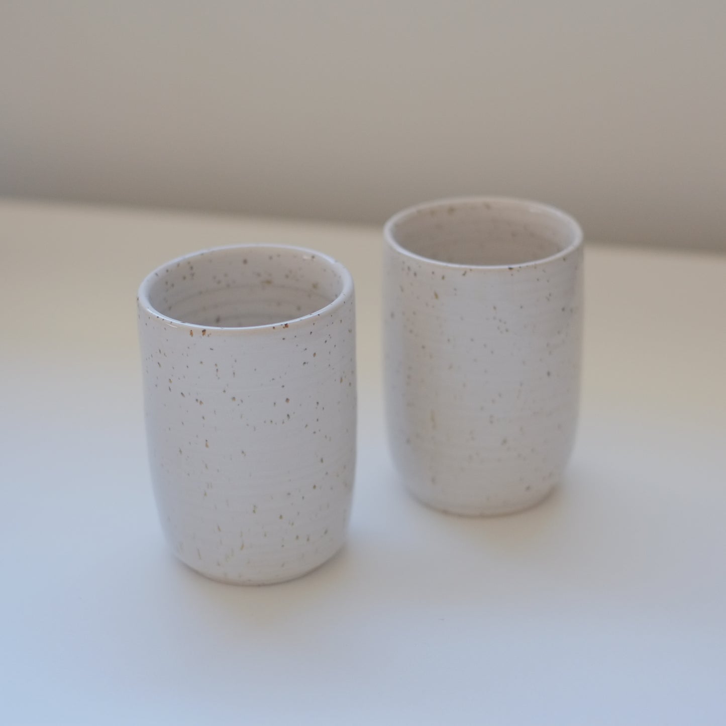 Pair of Speckled White Tumblers