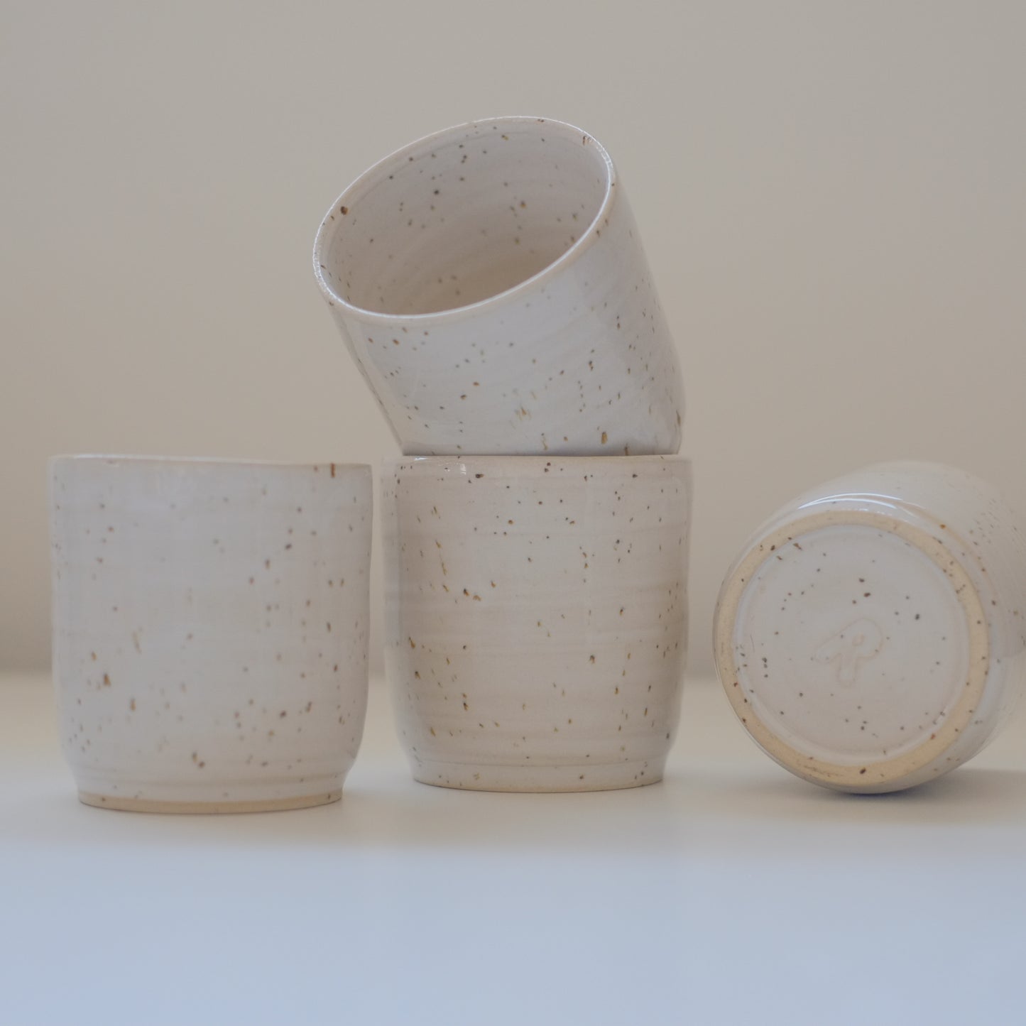 Four X-Small Speckled White Tumblers