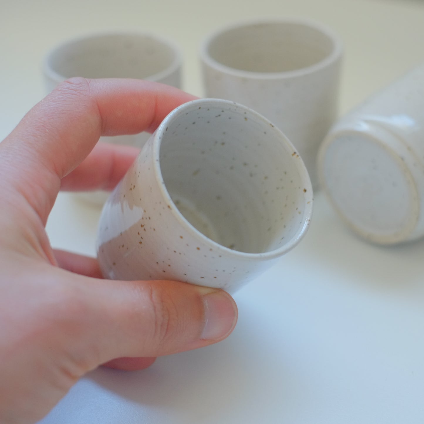 Four X-Small Speckled White Tumblers