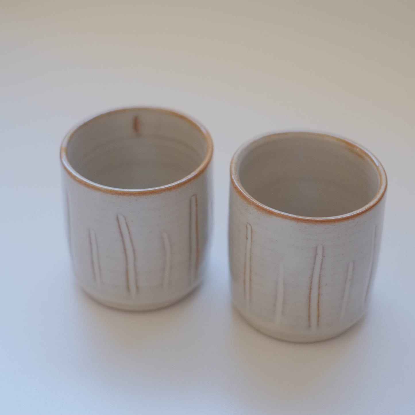 Two X-Small Cream/Tan Tumblers