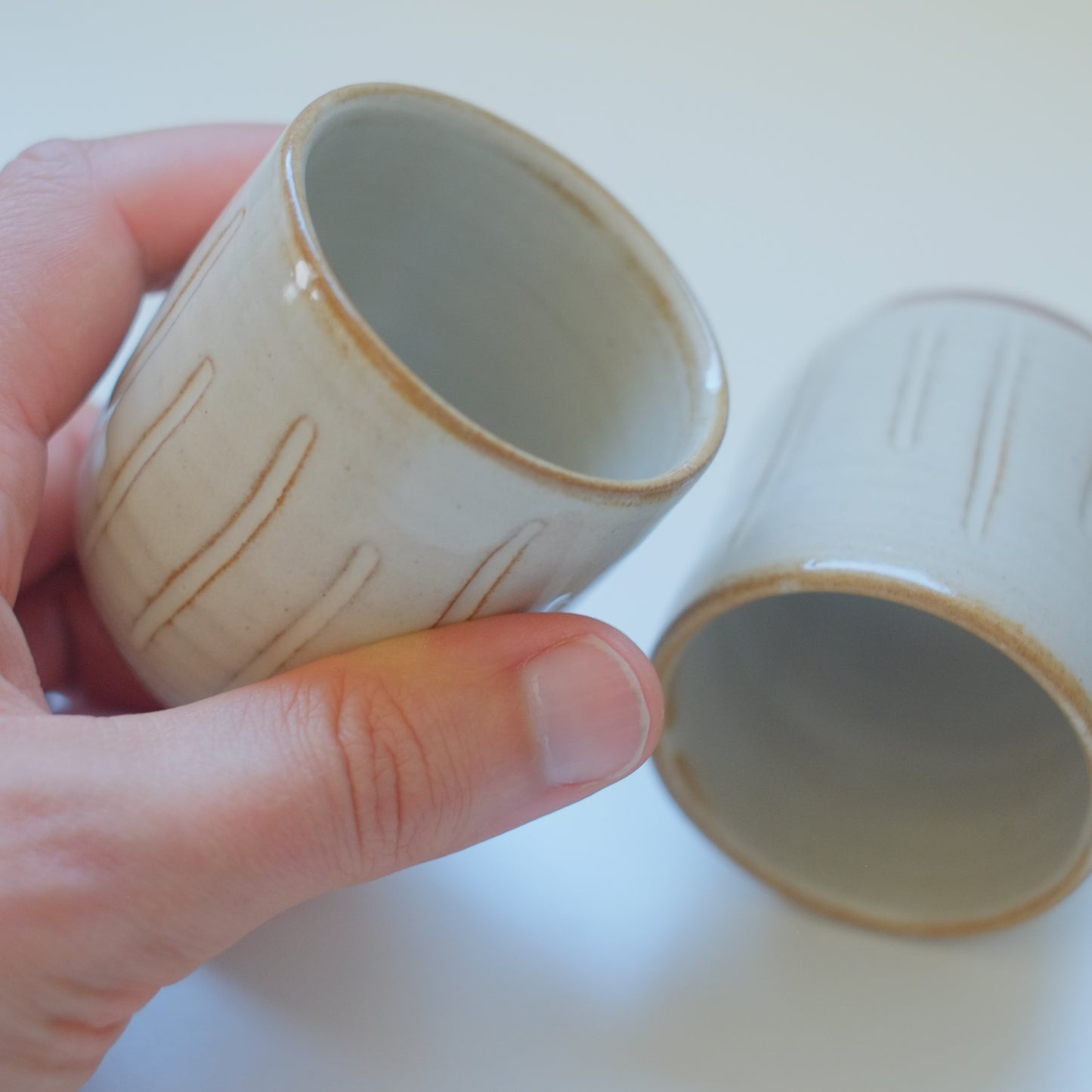 Two X-Small Cream/Tan Tumblers